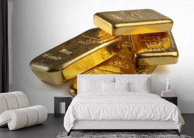 Several gold bars of different weight isolated on a white background. Wall mural