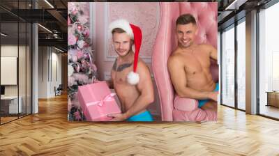 happy family and christmas. two sexy guys. Wall mural