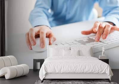 Men office worker typing on the keyboard Wall mural