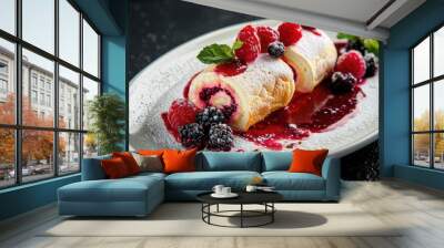 Cake rolls with berry sauce on a white plate on a black background Wall mural