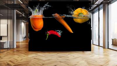 Fresh vegetables splashing in water on black Wall mural