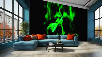 green flame on black background, background for placing text Wall mural