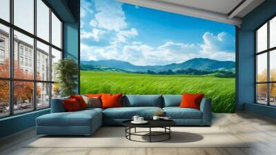 The picturesque beauty of a meadow set against the backdrop of a clear, blue summer sky Wall mural