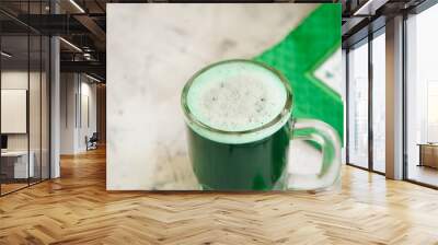 Green Beer in a glass jar on white background, selective focus Wall mural