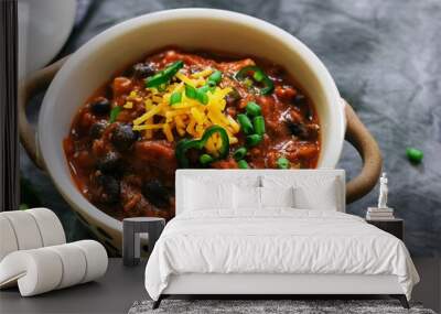 Homemade Beef Chili topped with Cheddar cheese and green onions Wall mural