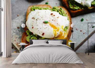 Poached egg avocado toast, selective focus Wall mural