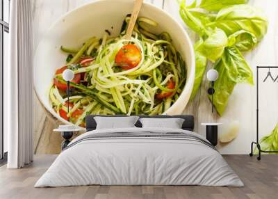 Zucchini pasta noodles with dressing in a white bowl Wall mural