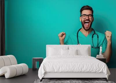 Excited male healthcare professional celebrating success in scrubs. Wall mural