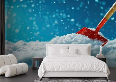 Snow shovel on fresh snow under bright sunlight and falling snowflakes. Wall mural