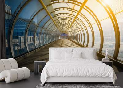 empty tunnel with footpath lit by sunset Wall mural