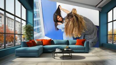 two girls fight in the office Wall mural