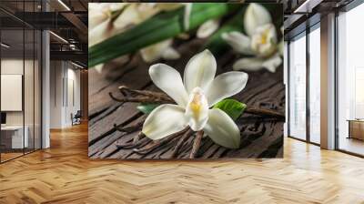 Dried vanilla sticks and vanilla orchid on wooden table. Wall mural