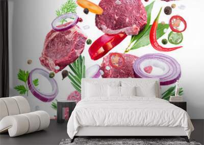 Falling down meat steaks and spices. Flying motion effect of cooking process. Wall mural