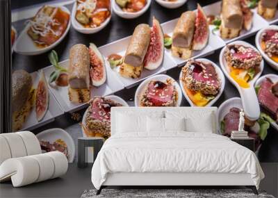 Gourmet appetizers: foie gras, venison, tuna and salmon. Wall mural