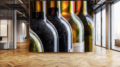 Line of wine bottles. Close-up. Wall mural