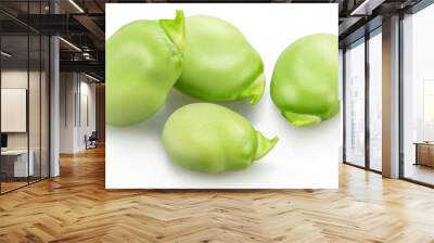 Several green young broad beans isolated on white background. Wall mural