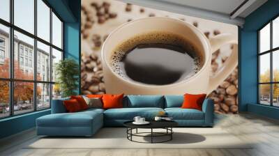 White cup of hot steaming coffee on a wooden table and roasted coffee beans near it. Wall mural