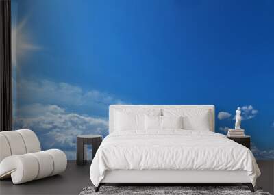 White heap clouds and bright sun in the blue sky. Wall mural