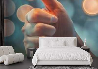 Glowing thumb up gesture against bokeh light background Wall mural