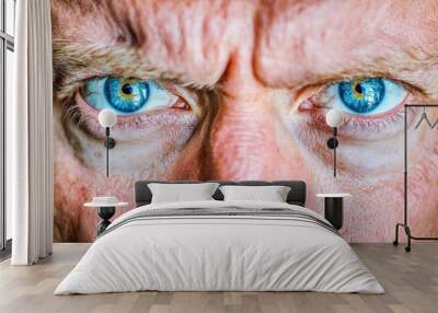 Intense blue-eyed adult caucasian gaze close-up Wall mural