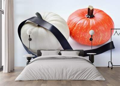 Vibrant orange white pumpkins with elegant black ribbon Wall mural