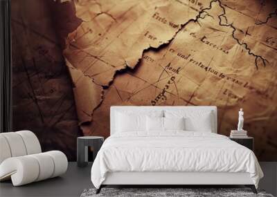 Vintage map close-up with aged paper texture and burnt edges Wall mural