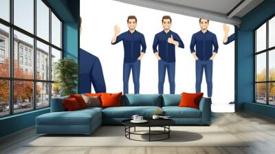 Set of young handsome man wearing blue shirt and jeans in different poses. Various gestures - greeting, showing ok sign, thumbs up, standing isolated vector illustration Wall mural