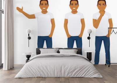 Young man in jeans standing in different poses isolated Wall mural