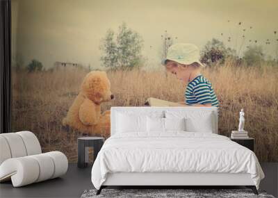 Cute girl reading book Teddy bear Wall mural