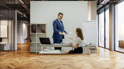 Manager and secretary working in the office. Wall mural