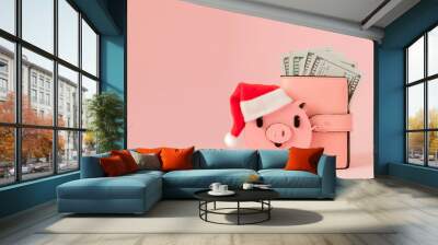 Pink Christmas pig and purse with dollars on the pink background Wall mural