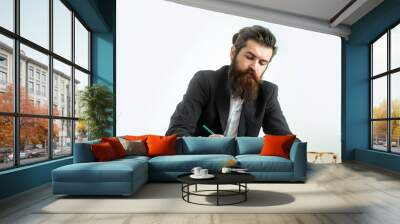 bearded man teacher at table Wall mural