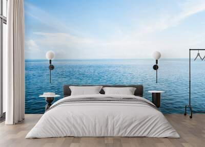 Blue sea with waves and sky with clouds. Wall mural