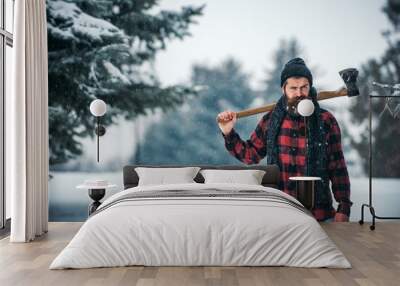 Christmas hipster lumberjack with ax in wood Wall mural