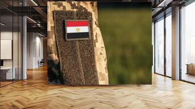 Close up millitary woman or man shoulder arm sleeve with Egypt flag patch. Egypt troops army, soldier camouflage uniform. Armed Forces, empty copy space for text
 Wall mural