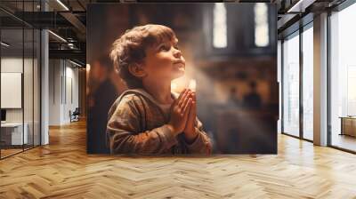 Cute small Latin boy praying in the church and Jesus giving blessing Wall mural