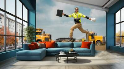 Fast building. Funny construction worker jumping. Excited jump of builders in helmet. Worker in hardhat. Construction engineer in builder uniform jump. Excited foreman jump. Speed build. Wall mural