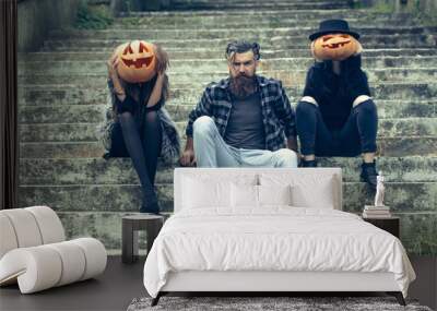 halloween man and girls with pumpkin Wall mural