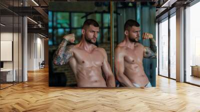 Handsome fit muscular caucasian man workout in the gym with weight pumping up muscles. Fitness and bodybuilding sport. Bodybuilder with dumbbells at gym, hard workout. Wall mural