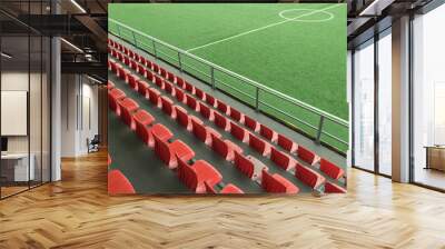 Empty rows with red  seats on a football stadium Wall mural