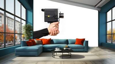 Female hand holding old style 8 mm movie camera on a white background Wall mural