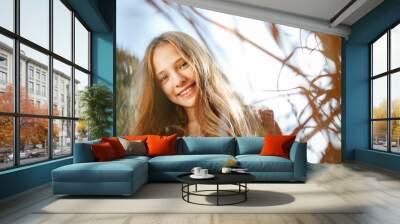 Lifestyle sunny outdoor portrait of young smiling teenage girl Wall mural