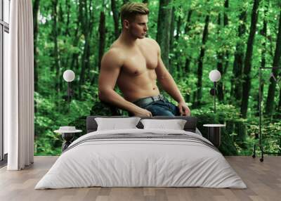 Man summer outdoor. Strong man showing his perfect naked body. Bare torso. Wall mural