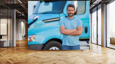 Men driver near lorry truck. Man owner truck . Serious middle aged man trucker trucking owner. Transportation industry vehicles. Handsome man driver front of truck. Wall mural