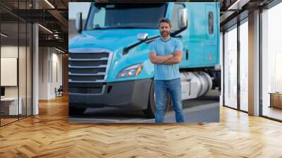 Men driver near lorry truck. Man owner truck driver. Millennial trucker. Trucking owner. Transportation industry vehicles. Handsome man posing in front of truck. Wall mural