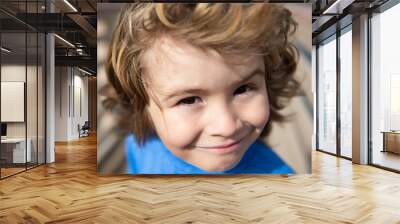 Portrait of a cute child boy. Close up caucasian kids face. Closeup head of funny kid. Wall mural