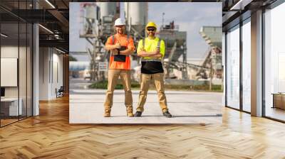 Professional heavy industry engineer workers in safety uniform and hard hat helmet. Factory engineer. Manufacturing facility working. Heavy industry manufacturing factory workers. Wall mural