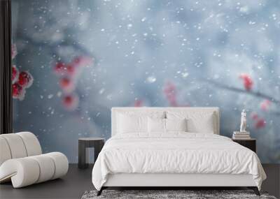 Red berries of mountain ash on a tree in winter during a snowfall, panorama Wall mural