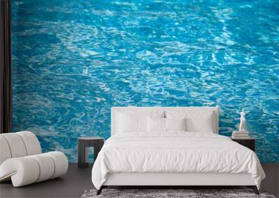 Ripped water in swimming pool. Surface of blue swimming pool, background of water. Wall mural