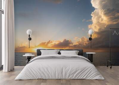 Sea sunset with cloudy sky and sun through the clouds over. Clouds Ocean and sky background, seascape. Wall mural